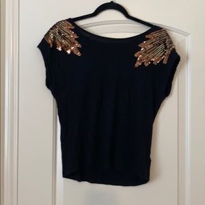 Black top with gold accents
